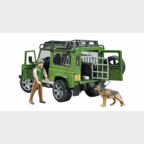 Land Rover Defender Station Wagon med skov og hund